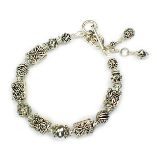 Both feature ornate handmade Bali silver beads with adjustable toggle clasps
