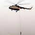 A MOCK DRILL OF EVACUATION PROCESS BY INDIAN AIR FORCE HELICOPTER AT THE REHEARSAL OF THE MILITARY TATTOO ON THE OCCASION OF ON GOING VIJAY DIWAS CELEBRATIONS AT RCTC GROUND