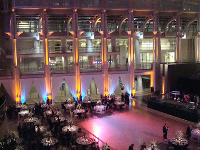 the ronald reagan building with lights drapings and flowers by us