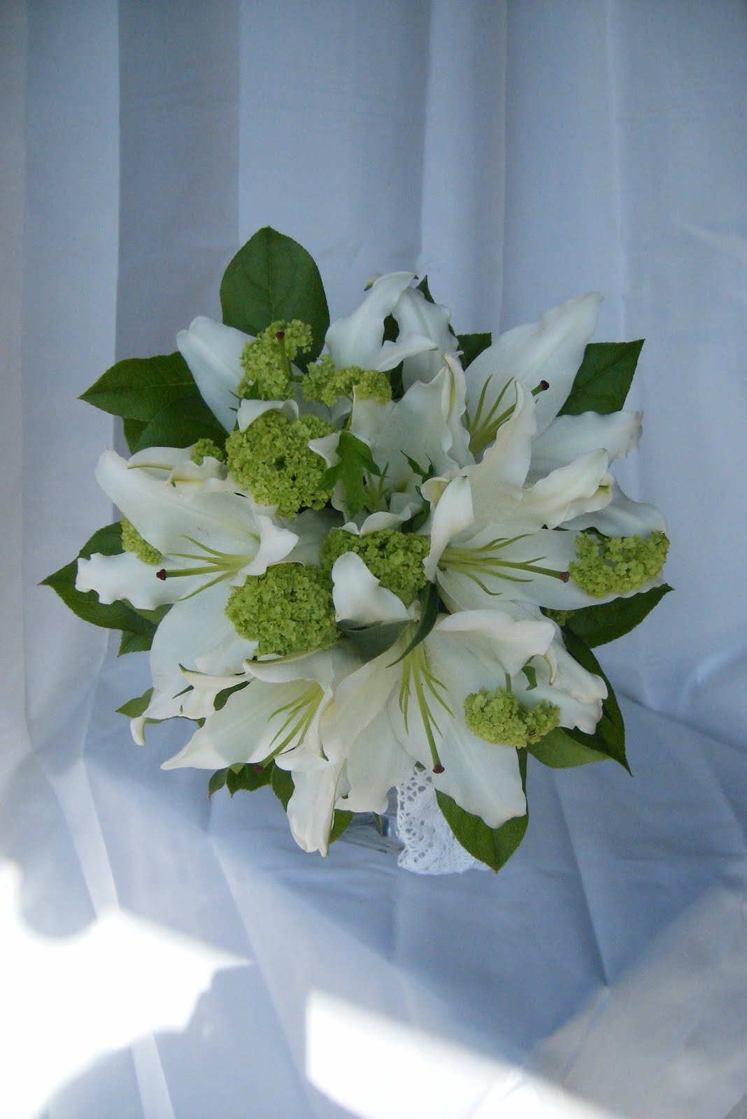 Tippetts Florist Flowers Oadby White Oriental Lily and green Viburnam