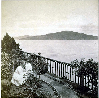 An officer's 2 girls in the gardens circa 1930's-40's