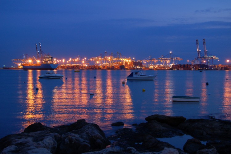 Glittering night lights of the Kalafrana Freeport as seen from across the Bay,