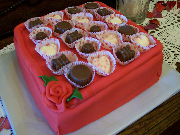 Carrot Cake with Red Fondant;  topped with Handmade Chocolates