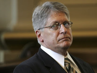 Nifong listens as rules violations are read at his NC State Bar trial on June 16, 2007 Nifong listens as rules violations are being announced during his NC State Bar trial in Raleigh on Sat., June 16, 2007