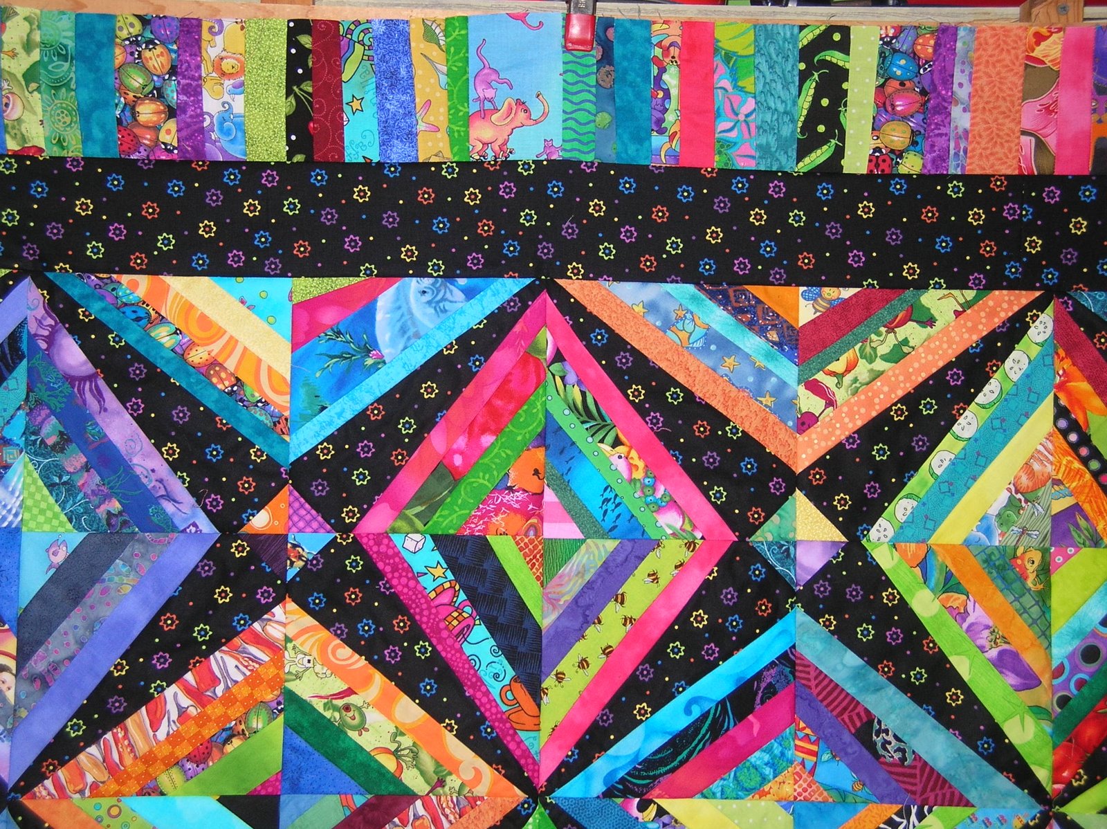 Quilts By Holly Bright scrappy string quilt