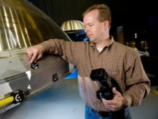 Rob Black Rob Black, senior applications engineer with Shape Fidelity Inc., of Huntsville, Ala., a contractor with the Ares I Upper Stage team, sets up for photogrammetry process.