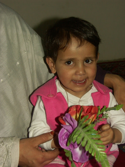 Najma at home in her mother's arms 2007