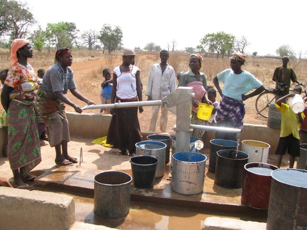 [Pumping+water+at+the+borehole.jpg]