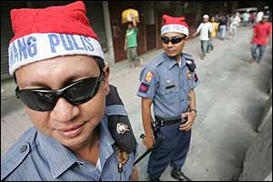 Police officers wearing Santa hats Police officers wearing Santa hats