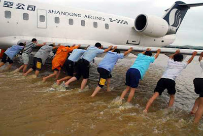 Airplane Airplane being push out of flooded areas