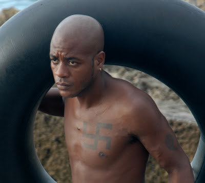 Black man in Cuba with swastika tattoo