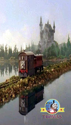 Tram Toby the tank engine at Lord Callans hillside castle lock going to the wooden windmill tower