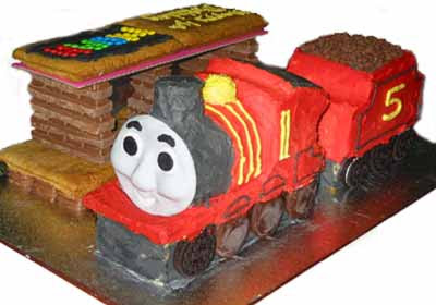 Island of Sodor cake with Thomas and friends James the red engine standing at the railway station Island of Sodor cake with Thomas and friends James the red engine standing at the railway station