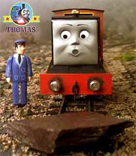 Hill rock landed on tracks strait in front little mountain railway engine Rusty train was shocked
