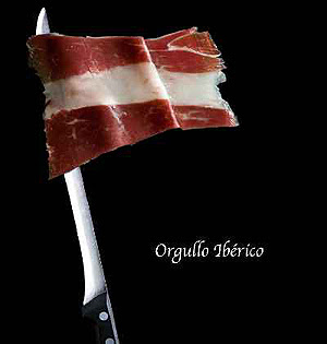 bandera española grasa entre jamón ensartada en cuchillo jamonero
