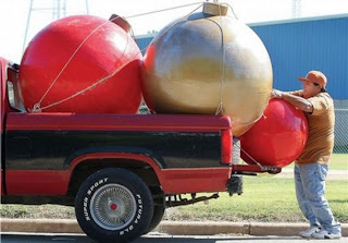 Oversize red Christmas tree ornaments transporting in a car hot gallery