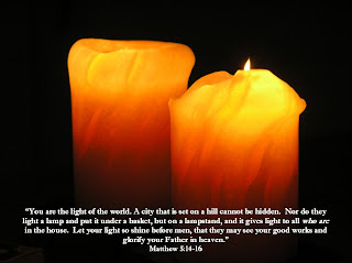 Two glowing yellowish red candles with Matthew 5: 14-16 bile verse sexy photo