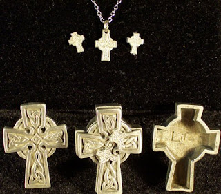Celtic Cross necklace and ear rings with black background desktop picture