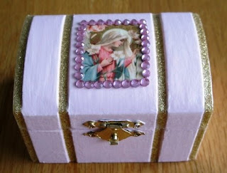 Wooden box painted purple with picture of Mary on top
