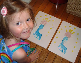 Girl next to painted paper