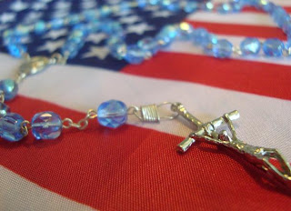 Rosary laid on American flag