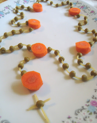 Rosary made of peas, carrots, and noodles