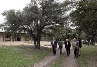 Bush's entourage takes a stroll around the vacation house