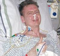 Ken Mackie in hospital five days after his double lung transplant