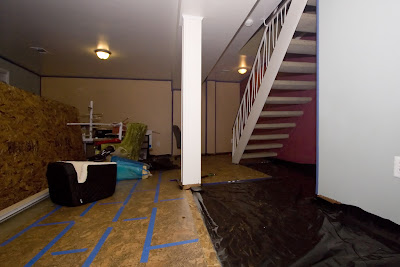 The last few rows of flooring to be completed... showing the vapor barrier before subfloor installation.