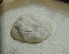 bread on pizza peel with flour