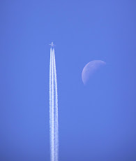 Vapour trail and the moon.