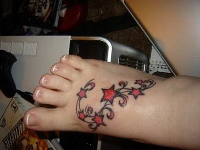 foot tattoos designs. Small star tattoos on foot for