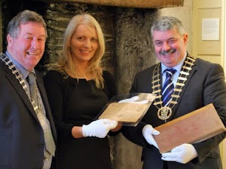 County Archivist Rene Franklin showing the telegram and minute book to the Deputy Mayor of Ennis, Cllr. Michael Guilfoyle and  Mayor of Clare, Cllr. Tony Mulcahy