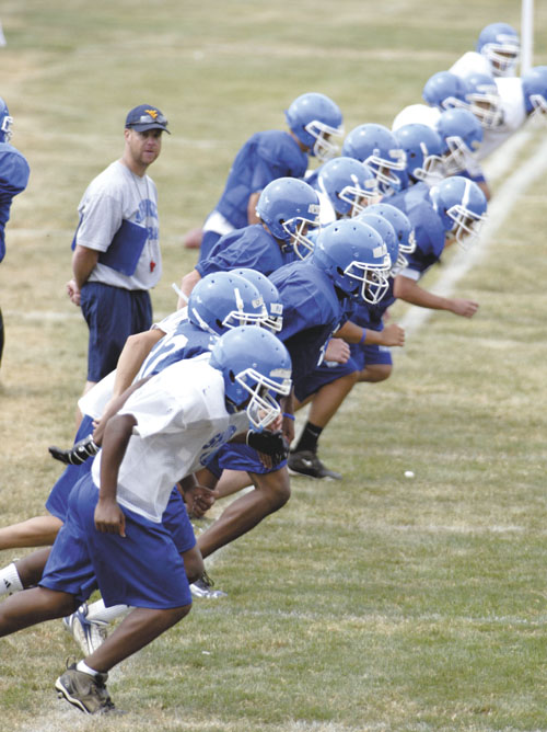 football players break off football players running. football players break off