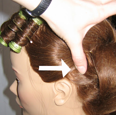 Then take the edges of the bun that are exposing the inside of the style and 