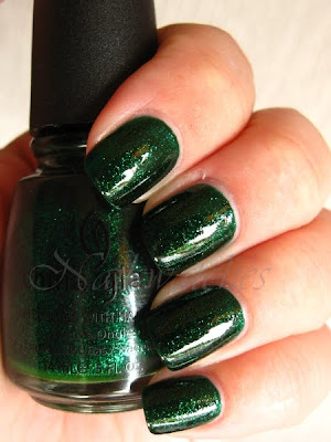 China Glaze Emerald Sparkle china glaze emerald sparkle green glitter jelly base nail polish permanent collection nailswatches
