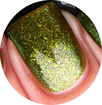 China Glaze Zombie Zest closeup china glaze zombie zest green glass flecks shimmer awakening limited edition collection 2010 halloween nail polish nailswatches