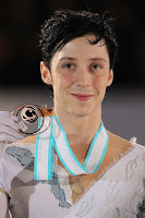 Johnny Weir displays his bronze medal from the 2009 Grand Prix Final. Photo courtesy daylife.com