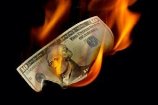 obama burning dollar