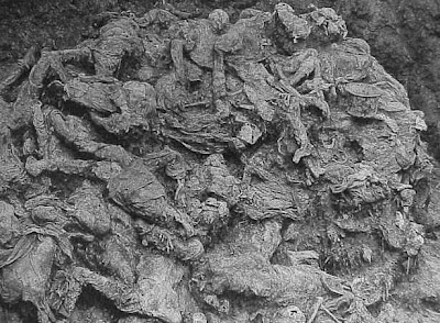PHOTO: Srebrenica genocide mass grave at Pilica farm, twenty feet deep and a PHOTO: Srebrenica genocide mass grave at Pilica farm, twenty feet deep and a