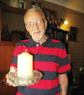 candlelight vigil with a big, big lighted candle