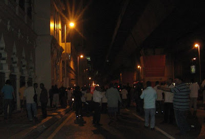 candlelight vigil marchers moving along Jalan Tun Perak candlelight vigil marchers moving along Jalan Tun Perak