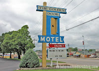 Rotating sign in front of the Golden Door Motel in Osage Beach, Missouri