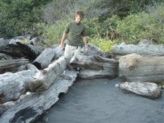 Rick building us a shelter in the drift wood