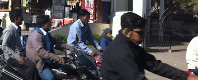 Pune India men wearing earmuffs