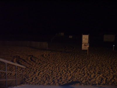 The night at Jones Beach with tire tracks.