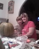 here is me and mckenzie carving pumpkins, we had fun!