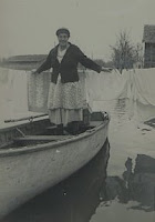 Liz hanging clothes during the 1950 flood