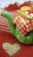 picnic table miniature teapot with baguette bread tomato brie cheese pork pie tomato in 12th scale made by hand by emmaflam and miniman paris miniatures