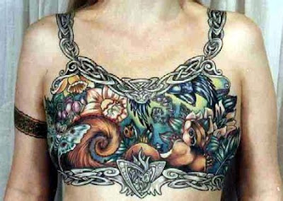 man boobs Rick Ross Tattoos are intricate but hardly tattooed breasts